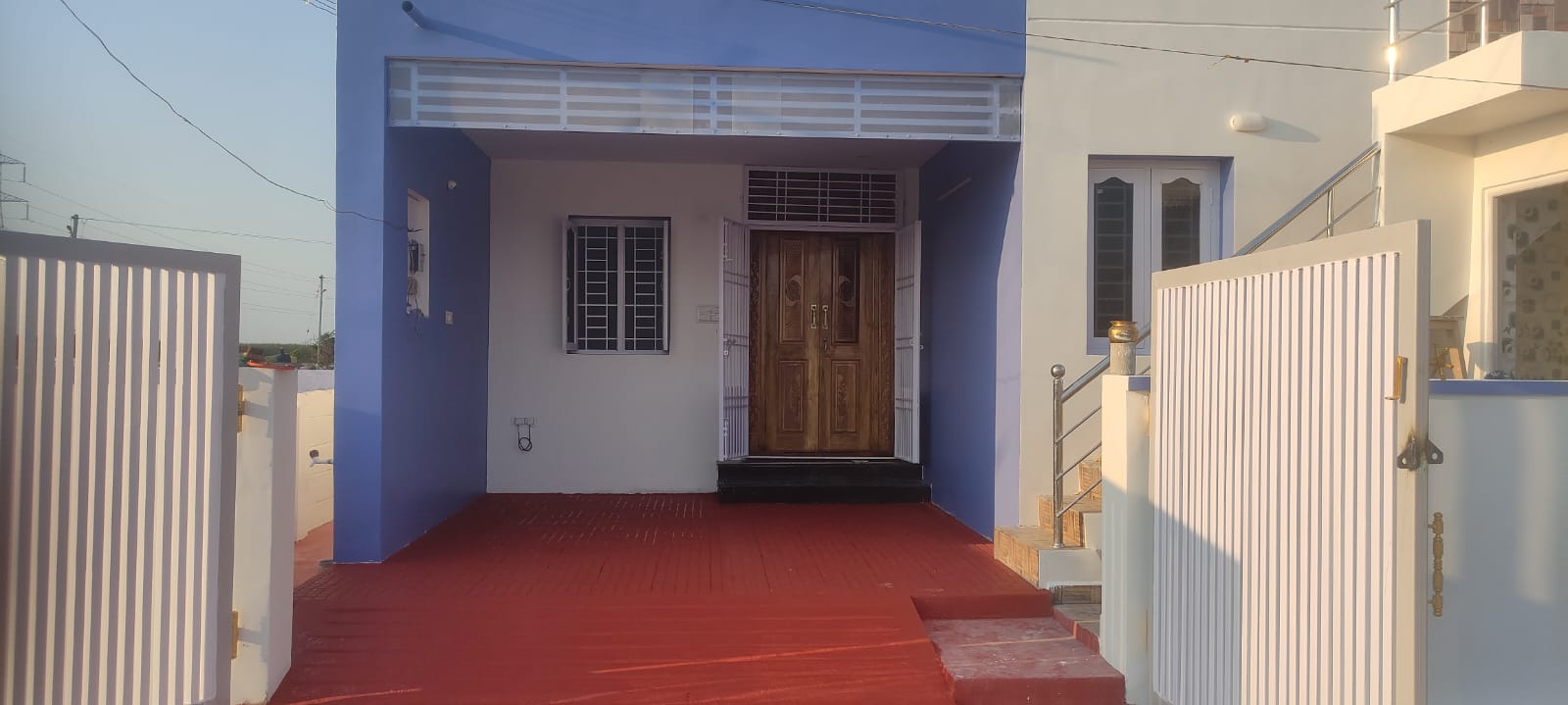 Covered entrance with polished red flooring