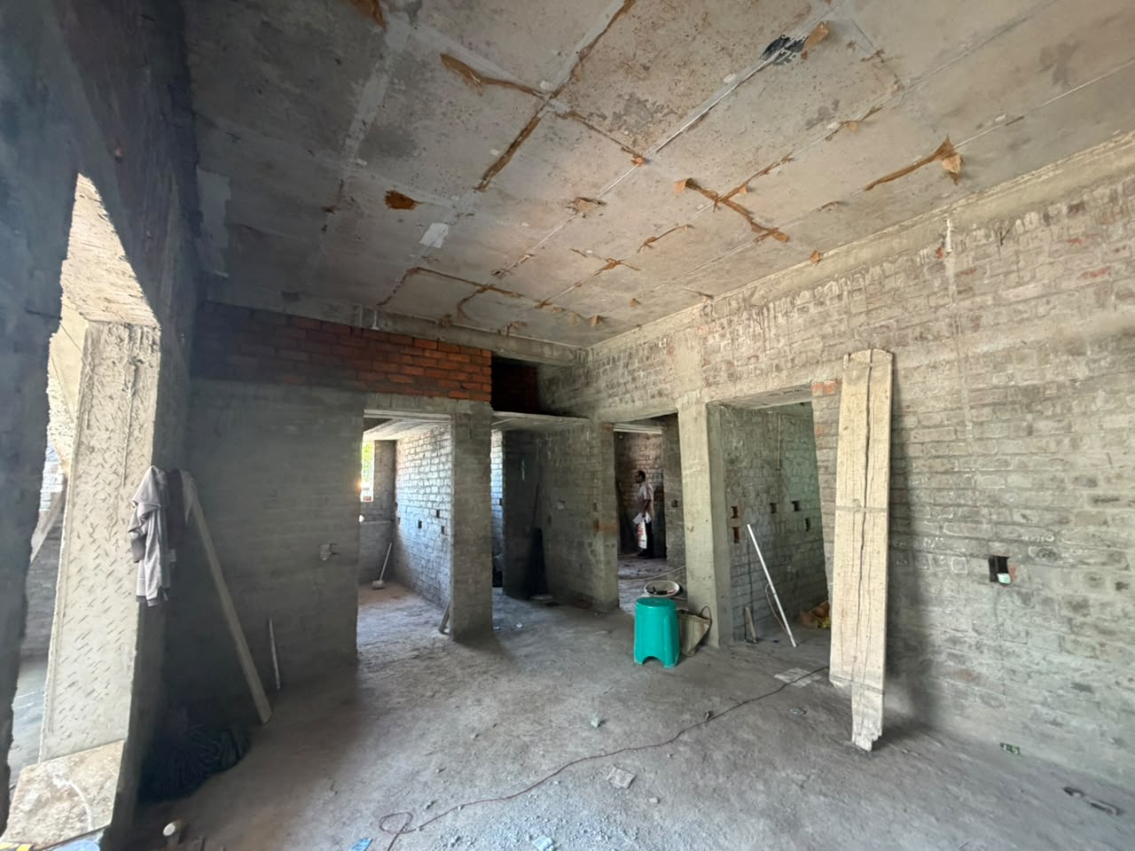 Structural interior during construction with cast beams